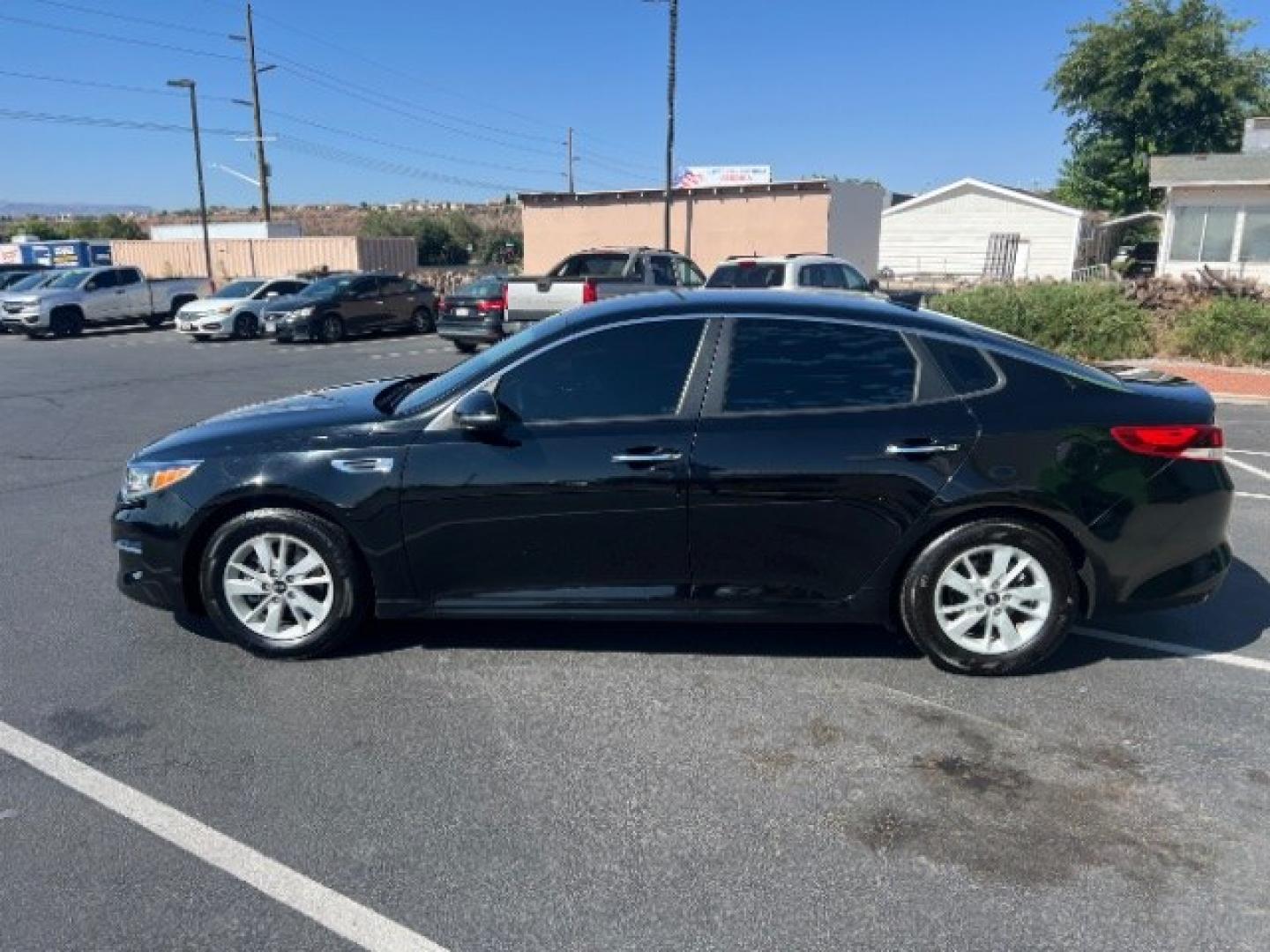 2016 Ebony Black /Black Kia Optima LX (5XXGT4L39GG) with an Theta II 2.4L I-4 gasoline direct injection engine, Automatic transmission, located at 1865 East Red Hills Pkwy, St. George, 84770, (435) 628-0023, 37.120850, -113.543640- Photo#3