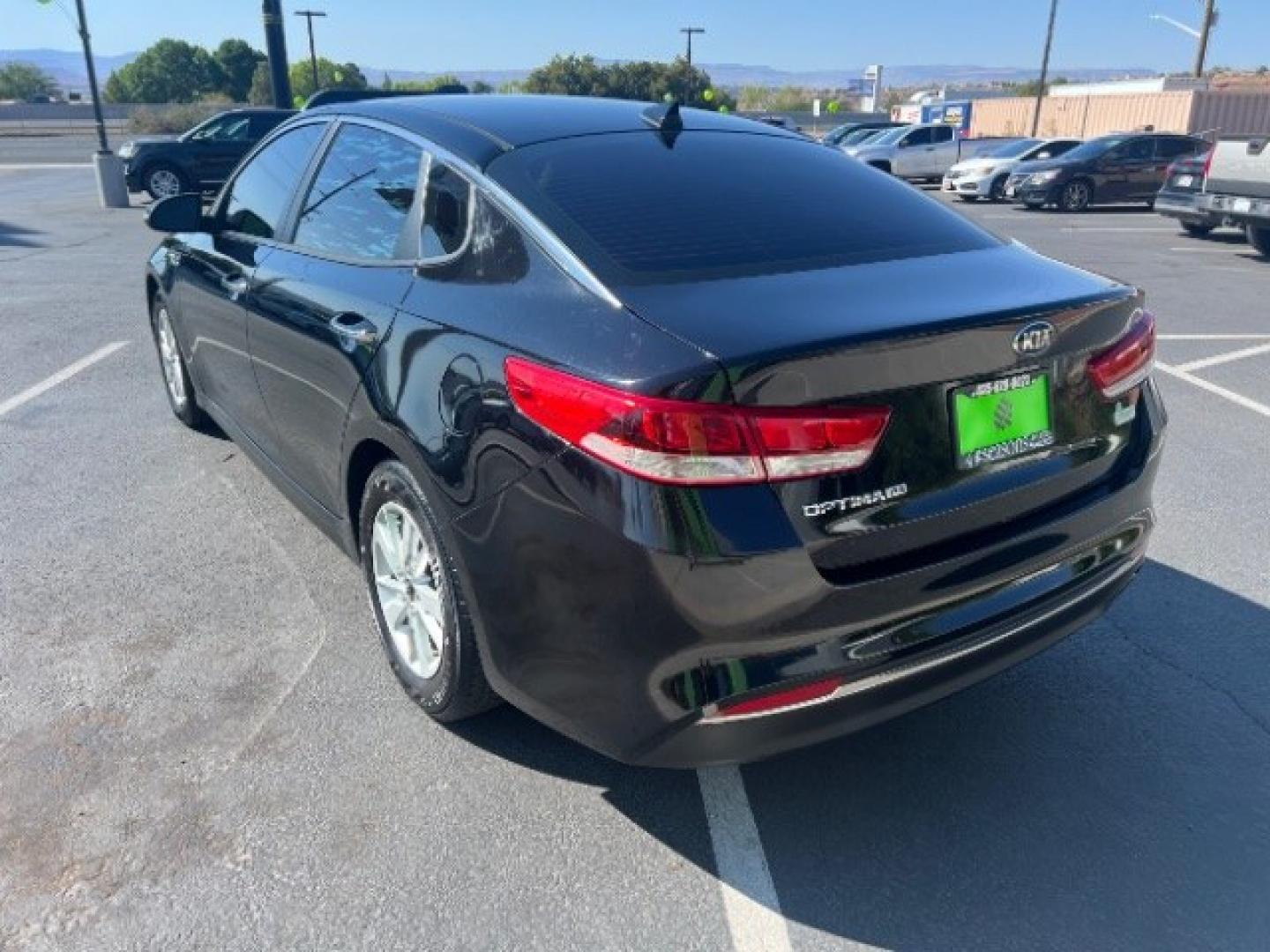 2016 Ebony Black /Black Kia Optima LX (5XXGT4L39GG) with an Theta II 2.4L I-4 gasoline direct injection engine, Automatic transmission, located at 1865 East Red Hills Pkwy, St. George, 84770, (435) 628-0023, 37.120850, -113.543640- Photo#4