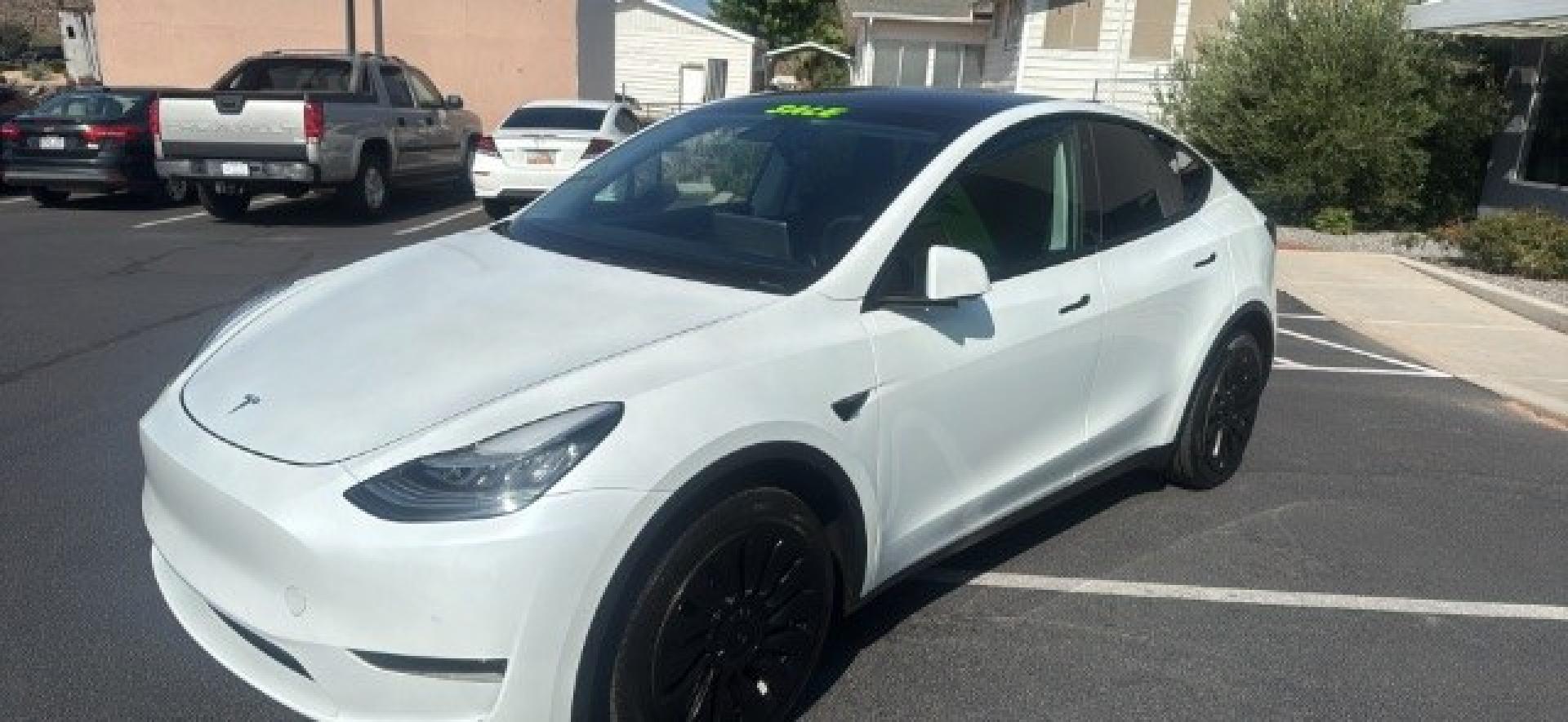 2020 Pearl White Multi-Coat /Black Tesla Model Y Long Range Dual Motor All-Wheel Drive (5YJYGDEEXLF) with an ELECTRIC engine, Electric transmission, located at 1865 East Red Hills Pkwy, St. George, 84770, (435) 628-0023, 37.120850, -113.543640 - Excellent Tesla Model Y Long Range All Wheel Drive, Acceleration Boost PAID FOR, 5 Seats HW3, Interior and exterior in great condition. Small scratches and dings as pictured. Every Tesla we sell has had cabin air filter replaced, radiator cleaned, fluids topped AND comes with a mobile charging kit- Photo#2