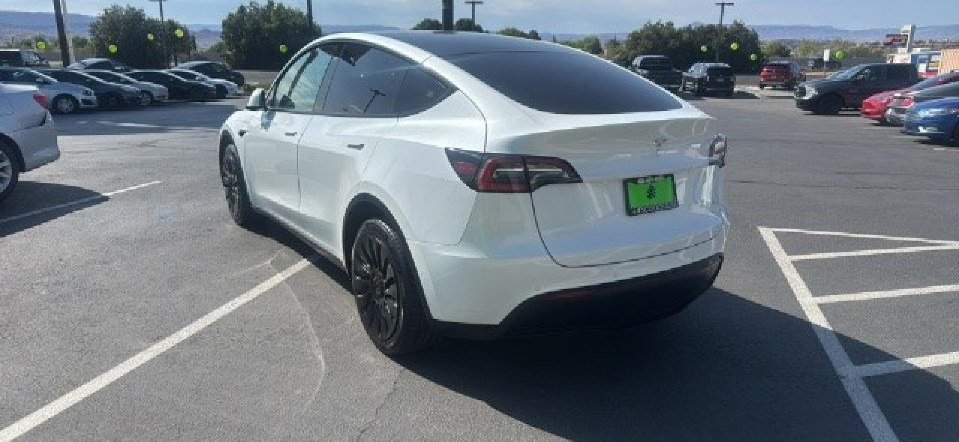 2020 Pearl White Multi-Coat /Black Tesla Model Y Long Range Dual Motor All-Wheel Drive (5YJYGDEEXLF) with an ELECTRIC engine, Electric transmission, located at 1865 East Red Hills Pkwy, St. George, 84770, (435) 628-0023, 37.120850, -113.543640 - Excellent Tesla Model Y Long Range All Wheel Drive, Acceleration Boost PAID FOR, 5 Seats HW3, Interior and exterior in great condition. Small scratches and dings as pictured. Every Tesla we sell has had cabin air filter replaced, radiator cleaned, fluids topped AND comes with a mobile charging kit- Photo#4