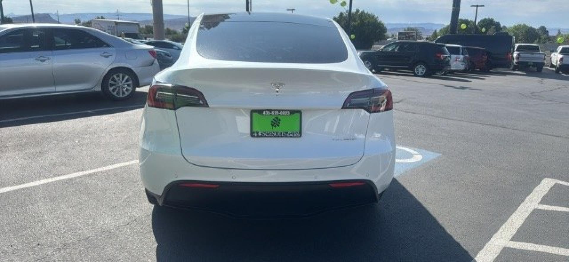 2020 Pearl White Multi-Coat /Black Tesla Model Y Long Range Dual Motor All-Wheel Drive (5YJYGDEEXLF) with an ELECTRIC engine, Electric transmission, located at 1865 East Red Hills Pkwy, St. George, 84770, (435) 628-0023, 37.120850, -113.543640 - Excellent Tesla Model Y Long Range All Wheel Drive, Acceleration Boost PAID FOR, 5 Seats HW3, Interior and exterior in great condition. Small scratches and dings as pictured. Every Tesla we sell has had cabin air filter replaced, radiator cleaned, fluids topped AND comes with a mobile charging kit- Photo#5
