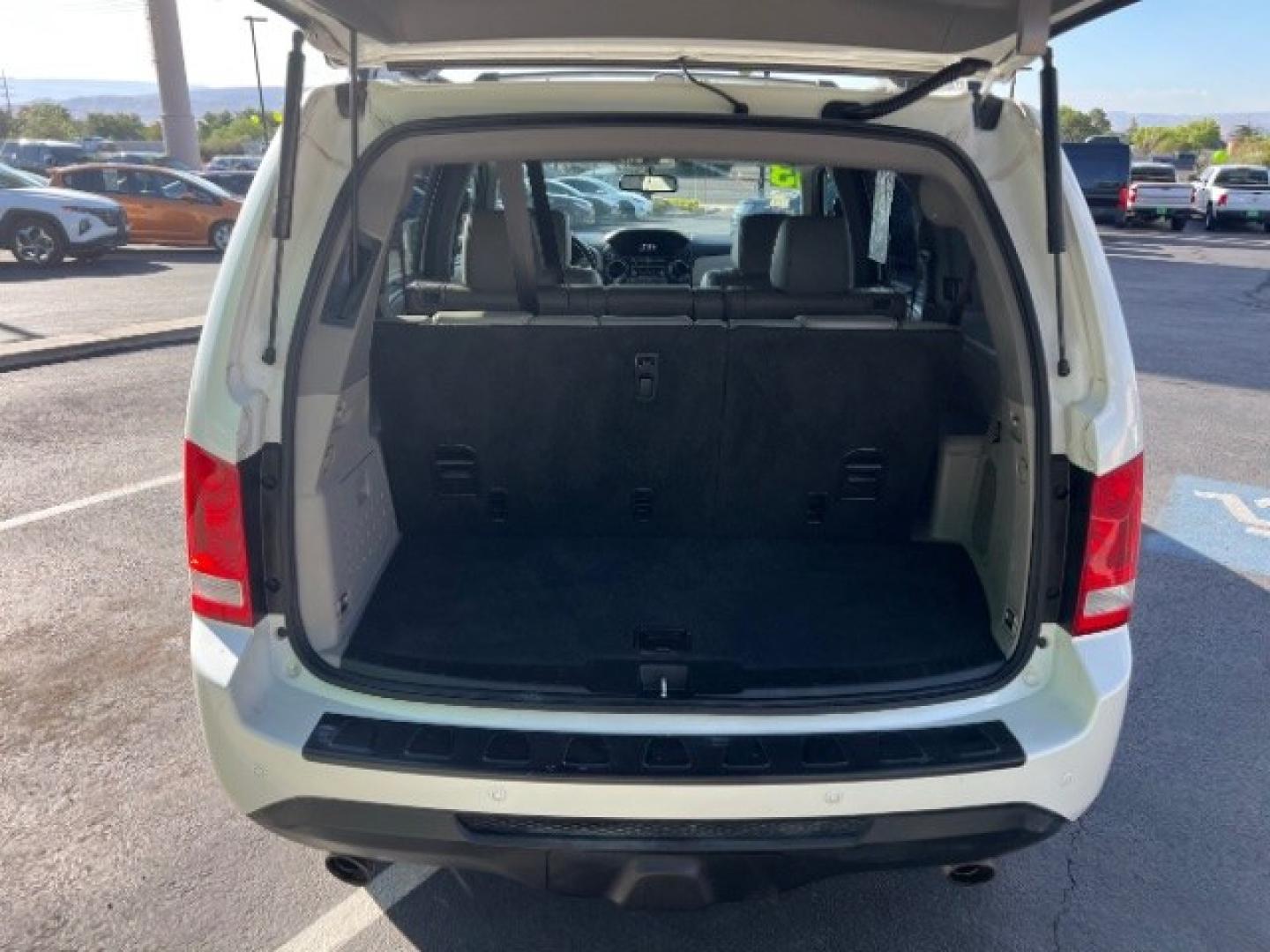 2013 White Diamond Pearl /Gray Honda Pilot Touring (5FNYF4H92DB) with an 3.5L V-6 i-VTEC VCM variable valve control engine, Automatic transmission, located at 940 North Main Street, Cedar City, UT, 84720, (435) 628-0023, 37.692936, -113.061897 - We specialize in helping ALL people get the best financing available. No matter your credit score, good, bad or none we can get you an amazing rate. Had a bankruptcy, divorce, or repossessions? We give you the green light to get your credit back on the road. Low down and affordable payments that fit- Photo#28