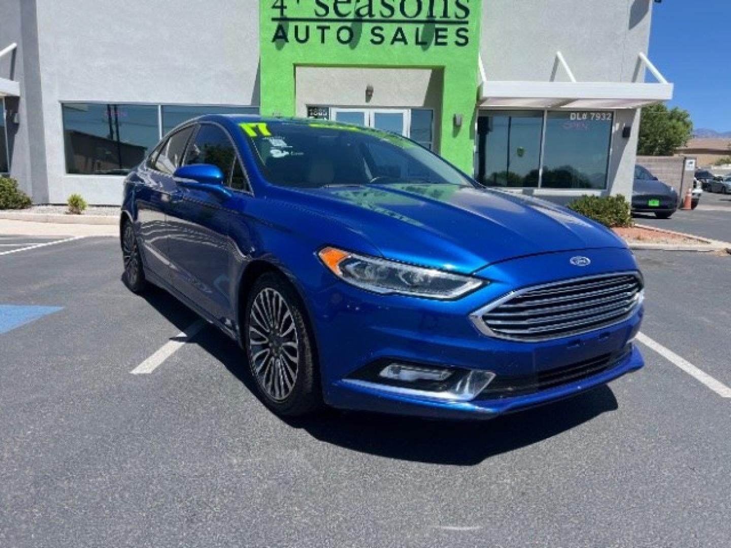 2017 Lightning Blue /Medium Soft Ceramic Ford Fusion Hybrid Titanium (3FA6P0RU8HR) with an 2L I-4 DOHC engine, Automatic transmission, located at 1865 East Red Hills Pkwy, St. George, 84770, (435) 628-0023, 37.120850, -113.543640 - We specialize in helping ALL people get the best financing available. No matter your credit score, good, bad or none we can get you an amazing rate. Had a bankruptcy, divorce, or repossessions? We give you the green light to get your credit back on the road. Low down and affordable payments that fit- Photo#0