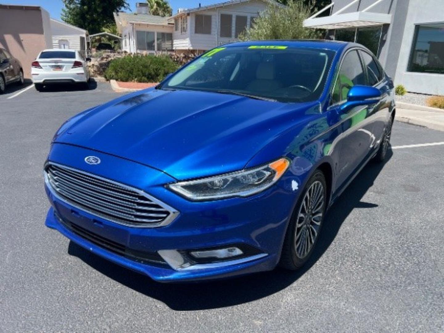 2017 Lightning Blue /Medium Soft Ceramic Ford Fusion Hybrid Titanium (3FA6P0RU8HR) with an 2L I-4 DOHC engine, Automatic transmission, located at 1865 East Red Hills Pkwy, St. George, 84770, (435) 628-0023, 37.120850, -113.543640 - We specialize in helping ALL people get the best financing available. No matter your credit score, good, bad or none we can get you an amazing rate. Had a bankruptcy, divorce, or repossessions? We give you the green light to get your credit back on the road. Low down and affordable payments that fit- Photo#2