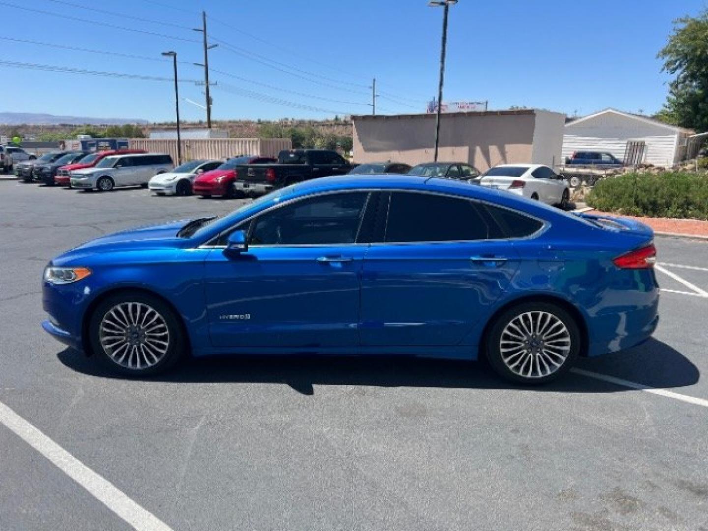 2017 Lightning Blue /Medium Soft Ceramic Ford Fusion Hybrid Titanium (3FA6P0RU8HR) with an 2L I-4 DOHC engine, Automatic transmission, located at 1865 East Red Hills Pkwy, St. George, 84770, (435) 628-0023, 37.120850, -113.543640 - We specialize in helping ALL people get the best financing available. No matter your credit score, good, bad or none we can get you an amazing rate. Had a bankruptcy, divorce, or repossessions? We give you the green light to get your credit back on the road. Low down and affordable payments that fit- Photo#3