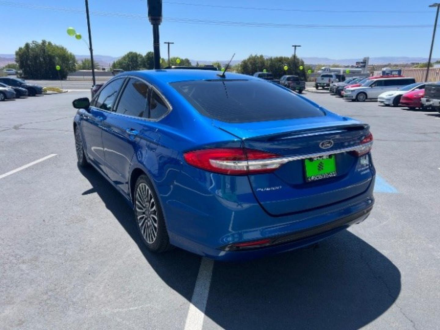 2017 Lightning Blue /Medium Soft Ceramic Ford Fusion Hybrid Titanium (3FA6P0RU8HR) with an 2L I-4 DOHC engine, Automatic transmission, located at 1865 East Red Hills Pkwy, St. George, 84770, (435) 628-0023, 37.120850, -113.543640 - We specialize in helping ALL people get the best financing available. No matter your credit score, good, bad or none we can get you an amazing rate. Had a bankruptcy, divorce, or repossessions? We give you the green light to get your credit back on the road. Low down and affordable payments that fit- Photo#4