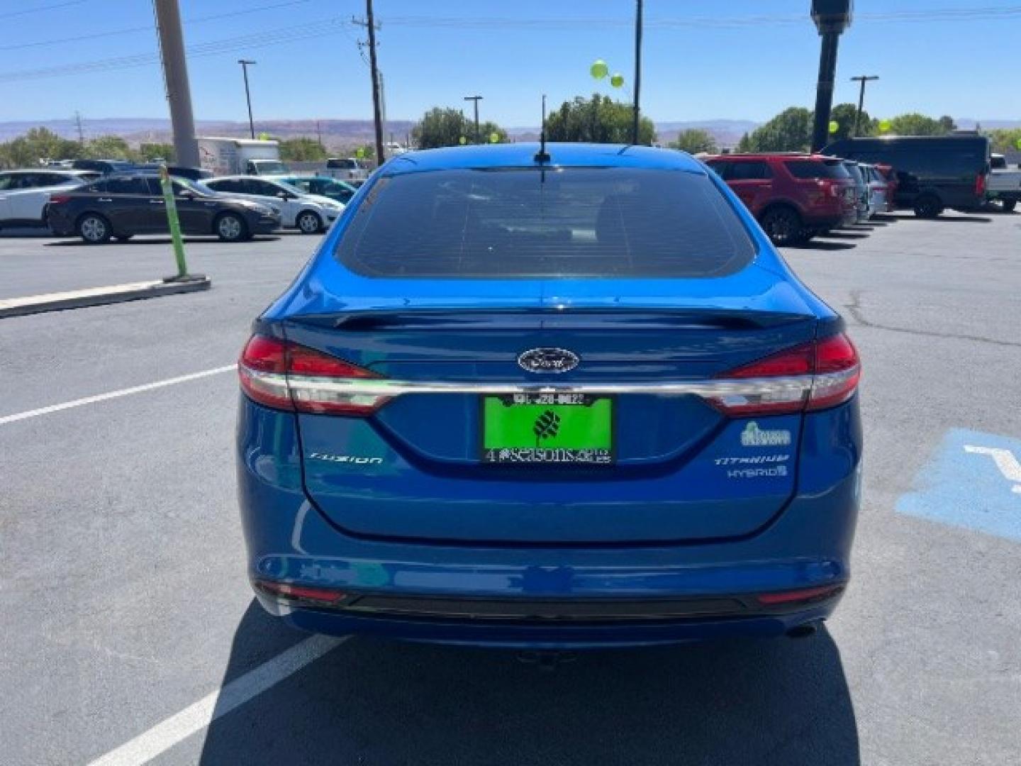 2017 Lightning Blue /Medium Soft Ceramic Ford Fusion Hybrid Titanium (3FA6P0RU8HR) with an 2L I-4 DOHC engine, Automatic transmission, located at 1865 East Red Hills Pkwy, St. George, 84770, (435) 628-0023, 37.120850, -113.543640 - We specialize in helping ALL people get the best financing available. No matter your credit score, good, bad or none we can get you an amazing rate. Had a bankruptcy, divorce, or repossessions? We give you the green light to get your credit back on the road. Low down and affordable payments that fit- Photo#5