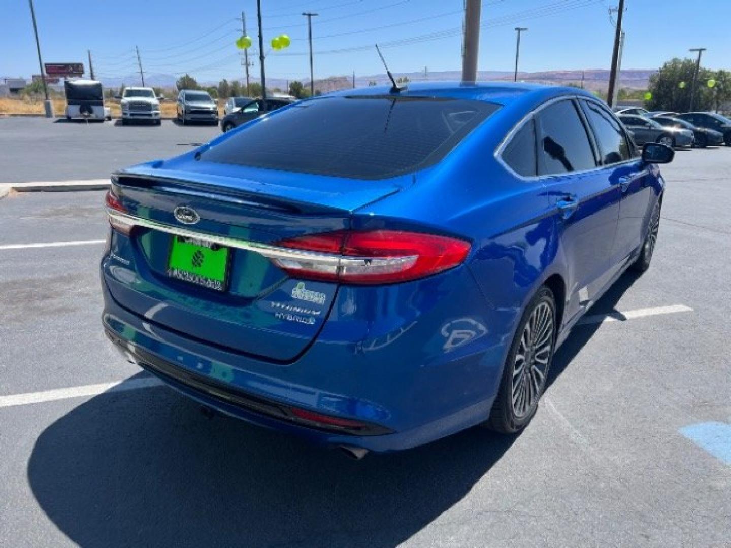 2017 Lightning Blue /Medium Soft Ceramic Ford Fusion Hybrid Titanium (3FA6P0RU8HR) with an 2L I-4 DOHC engine, Automatic transmission, located at 1865 East Red Hills Pkwy, St. George, 84770, (435) 628-0023, 37.120850, -113.543640 - We specialize in helping ALL people get the best financing available. No matter your credit score, good, bad or none we can get you an amazing rate. Had a bankruptcy, divorce, or repossessions? We give you the green light to get your credit back on the road. Low down and affordable payments that fit- Photo#6