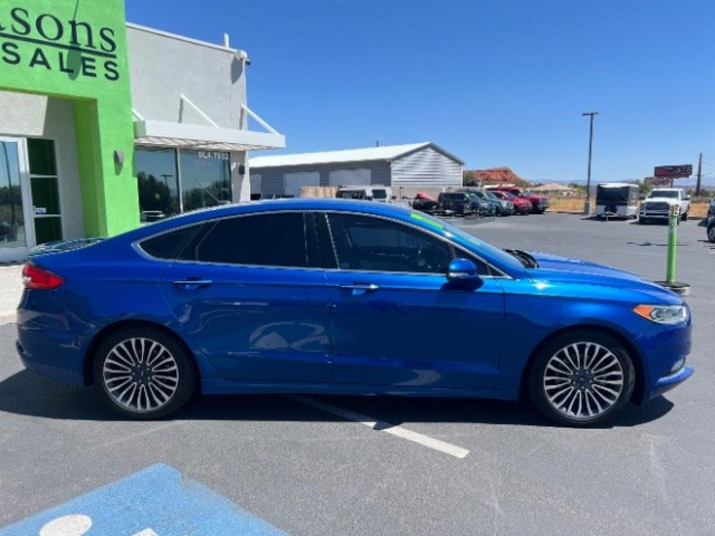 2017 Lightning Blue /Medium Soft Ceramic Ford Fusion Hybrid Titanium (3FA6P0RU8HR) with an 2L I-4 DOHC engine, Automatic transmission, located at 1865 East Red Hills Pkwy, St. George, 84770, (435) 628-0023, 37.120850, -113.543640 - We specialize in helping ALL people get the best financing available. No matter your credit score, good, bad or none we can get you an amazing rate. Had a bankruptcy, divorce, or repossessions? We give you the green light to get your credit back on the road. Low down and affordable payments that fit- Photo#7