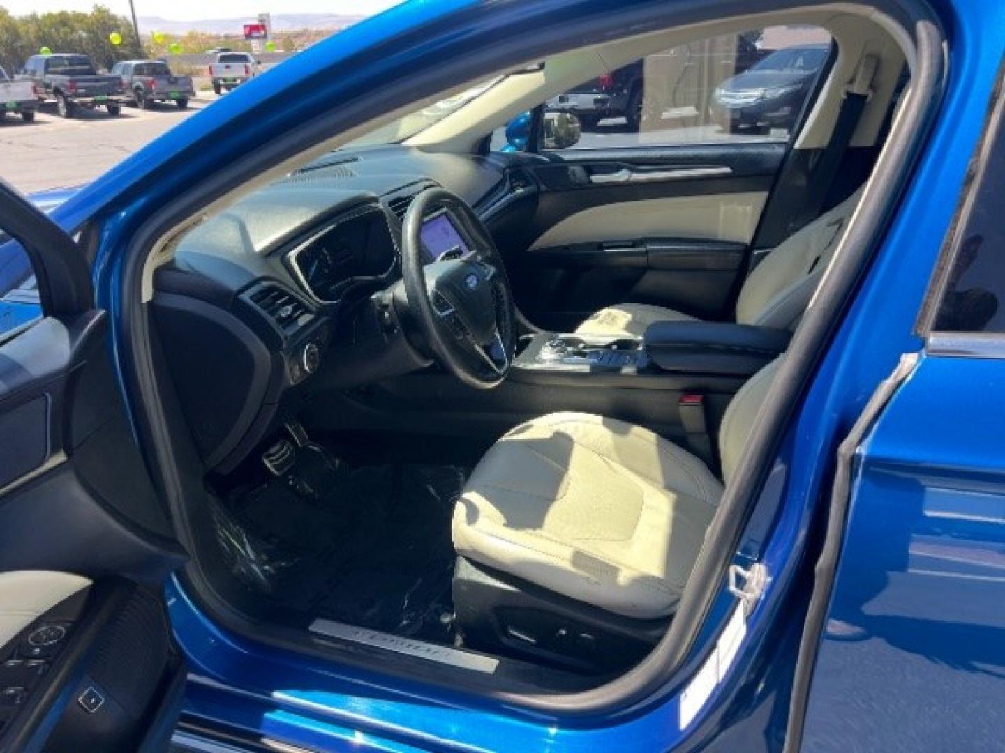 2017 Lightning Blue /Medium Soft Ceramic Ford Fusion Hybrid Titanium (3FA6P0RU8HR) with an 2L I-4 DOHC engine, Automatic transmission, located at 1865 East Red Hills Pkwy, St. George, 84770, (435) 628-0023, 37.120850, -113.543640 - We specialize in helping ALL people get the best financing available. No matter your credit score, good, bad or none we can get you an amazing rate. Had a bankruptcy, divorce, or repossessions? We give you the green light to get your credit back on the road. Low down and affordable payments that fit- Photo#14