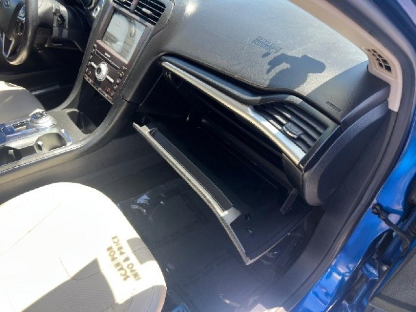 2017 Lightning Blue /Medium Soft Ceramic Ford Fusion Hybrid Titanium (3FA6P0RU8HR) with an 2L I-4 DOHC engine, Automatic transmission, located at 1865 East Red Hills Pkwy, St. George, 84770, (435) 628-0023, 37.120850, -113.543640 - We specialize in helping ALL people get the best financing available. No matter your credit score, good, bad or none we can get you an amazing rate. Had a bankruptcy, divorce, or repossessions? We give you the green light to get your credit back on the road. Low down and affordable payments that fit- Photo#28
