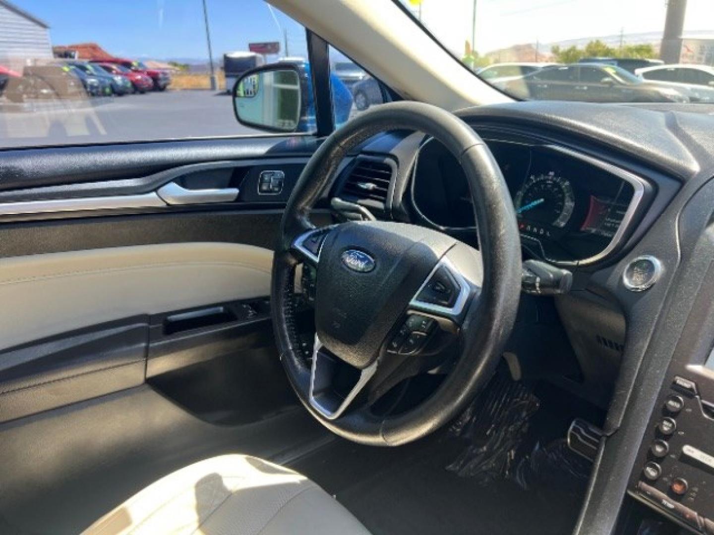 2017 Lightning Blue /Medium Soft Ceramic Ford Fusion Hybrid Titanium (3FA6P0RU8HR) with an 2L I-4 DOHC engine, Automatic transmission, located at 1865 East Red Hills Pkwy, St. George, 84770, (435) 628-0023, 37.120850, -113.543640 - We specialize in helping ALL people get the best financing available. No matter your credit score, good, bad or none we can get you an amazing rate. Had a bankruptcy, divorce, or repossessions? We give you the green light to get your credit back on the road. Low down and affordable payments that fit- Photo#29