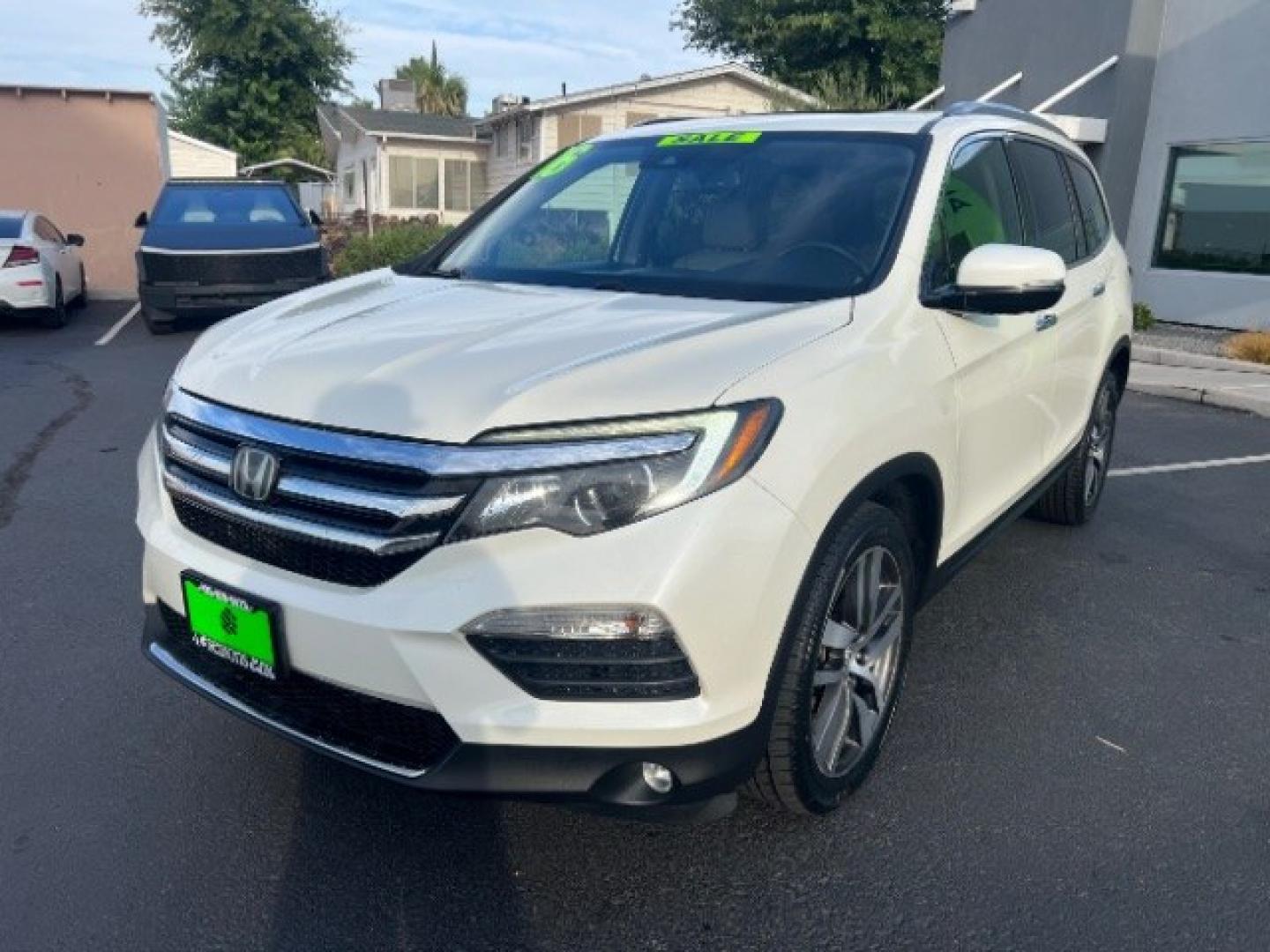 2016 White Diamond Pearl /Beige Honda Pilot Touring (5FNYF5H93GB) with an 3.5L V-6 gasoline direct injection engine, Automatic transmission, located at 1865 East Red Hills Pkwy, St. George, 84770, (435) 628-0023, 37.120850, -113.543640 - We specialize in helping ALL people get the best financing available. No matter your credit score, good, bad or none we can get you an amazing rate. Had a bankruptcy, divorce, or repossessions? We give you the green light to get your credit back on the road. Low down and affordable payments that fit- Photo#2