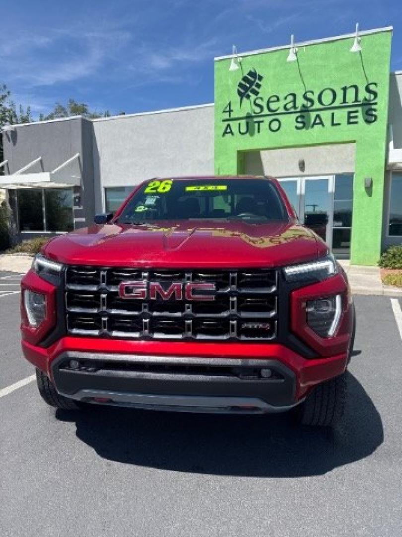 2026 Volcanic Red Tintcoat /Jet Black/Timber GMC Canyon AT4, 4WD (1GTP2DEK9T1) with an 2.7L I-4 direct injection engine, Automatic transmission, located at 1865 East Red Hills Pkwy, St. George, 84770, (435) 628-0023, 37.120850, -113.543640 - Practically new and ready for Southern Utah? This Volcanic Red Tintcoat 2026 GMC Canyon AT4 4WD brings a VIN-decoded 2.7L TurboMax 4-cylinder, 8-speed automatic, and confident 4x4 traction for daily driving, trailheads, and work. With only 13,031 miles, it has the look and capability of a fresh pick- Photo#1