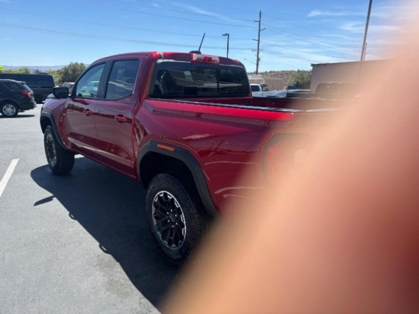 2026 Volcanic Red Tintcoat /Jet Black/Timber GMC Canyon AT4, 4WD (1GTP2DEK9T1) with an 2.7L I-4 direct injection engine, Automatic transmission, located at 1865 East Red Hills Pkwy, St. George, 84770, (435) 628-0023, 37.120850, -113.543640 - Practically new and ready for Southern Utah? This Volcanic Red Tintcoat 2026 GMC Canyon AT4 4WD brings a VIN-decoded 2.7L TurboMax 4-cylinder, 8-speed automatic, and confident 4x4 traction for daily driving, trailheads, and work. With only 13,031 miles, it has the look and capability of a fresh pick- Photo#4