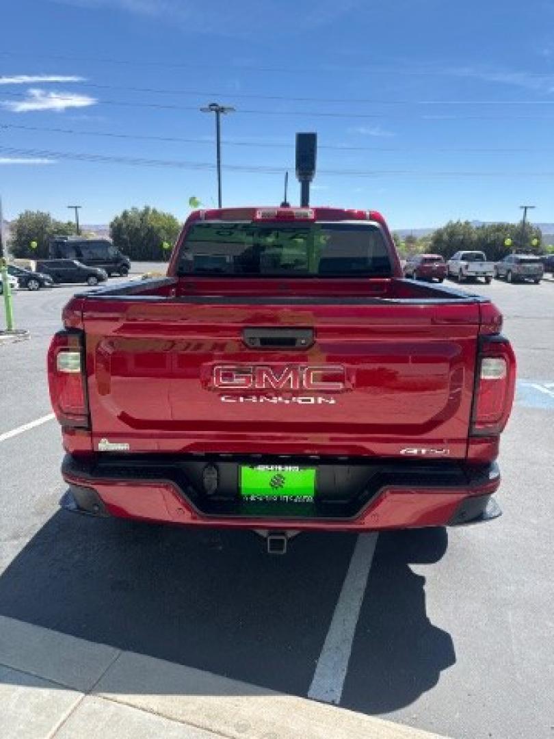 2026 Volcanic Red Tintcoat /Jet Black/Timber GMC Canyon AT4, 4WD (1GTP2DEK9T1) with an 2.7L I-4 direct injection engine, Automatic transmission, located at 1865 East Red Hills Pkwy, St. George, 84770, (435) 628-0023, 37.120850, -113.543640 - Practically new and ready for Southern Utah? This Volcanic Red Tintcoat 2026 GMC Canyon AT4 4WD brings a VIN-decoded 2.7L TurboMax 4-cylinder, 8-speed automatic, and confident 4x4 traction for daily driving, trailheads, and work. With only 13,031 miles, it has the look and capability of a fresh pick- Photo#5
