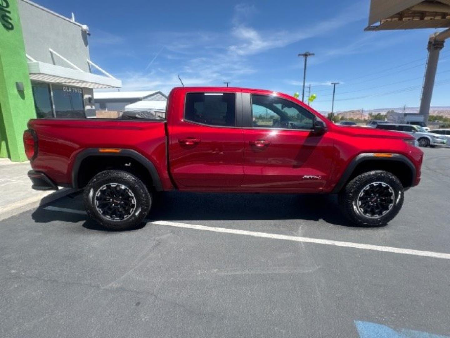 2026 Volcanic Red Tintcoat /Jet Black/Timber GMC Canyon AT4, 4WD (1GTP2DEK9T1) with an 2.7L I-4 direct injection engine, Automatic transmission, located at 1865 East Red Hills Pkwy, St. George, 84770, (435) 628-0023, 37.120850, -113.543640 - Practically new and ready for Southern Utah? This Volcanic Red Tintcoat 2026 GMC Canyon AT4 4WD brings a VIN-decoded 2.7L TurboMax 4-cylinder, 8-speed automatic, and confident 4x4 traction for daily driving, trailheads, and work. With only 13,031 miles, it has the look and capability of a fresh pick- Photo#7