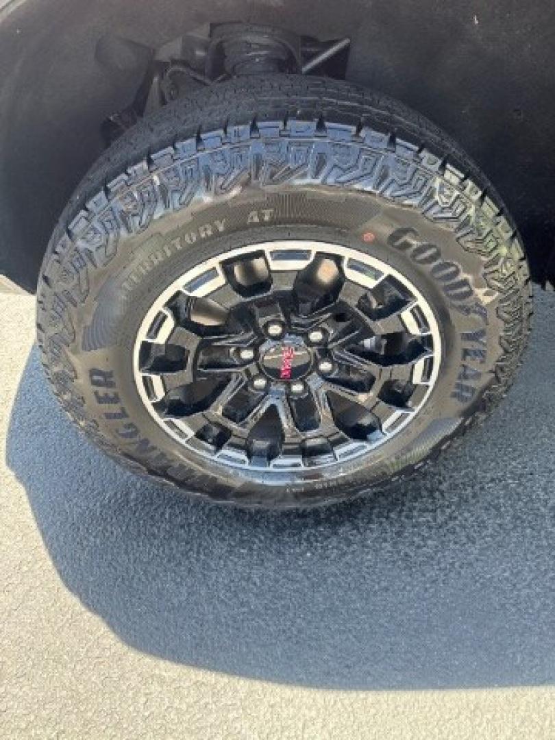 2026 Volcanic Red Tintcoat /Jet Black/Timber GMC Canyon AT4, 4WD (1GTP2DEK9T1) with an 2.7L I-4 direct injection engine, Automatic transmission, located at 1865 East Red Hills Pkwy, St. George, 84770, (435) 628-0023, 37.120850, -113.543640 - Practically new and ready for Southern Utah? This Volcanic Red Tintcoat 2026 GMC Canyon AT4 4WD brings a VIN-decoded 2.7L TurboMax 4-cylinder, 8-speed automatic, and confident 4x4 traction for daily driving, trailheads, and work. With only 13,031 miles, it has the look and capability of a fresh pick- Photo#11