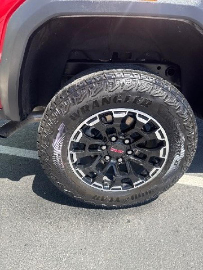 2026 Volcanic Red Tintcoat /Jet Black/Timber GMC Canyon AT4, 4WD (1GTP2DEK9T1) with an 2.7L I-4 direct injection engine, Automatic transmission, located at 1865 East Red Hills Pkwy, St. George, 84770, (435) 628-0023, 37.120850, -113.543640 - Practically new and ready for Southern Utah? This Volcanic Red Tintcoat 2026 GMC Canyon AT4 4WD brings a VIN-decoded 2.7L TurboMax 4-cylinder, 8-speed automatic, and confident 4x4 traction for daily driving, trailheads, and work. With only 13,031 miles, it has the look and capability of a fresh pick- Photo#13