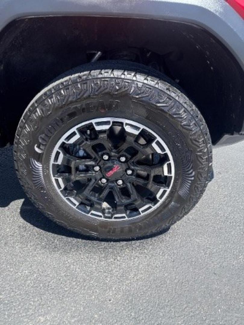 2026 Volcanic Red Tintcoat /Jet Black/Timber GMC Canyon AT4, 4WD (1GTP2DEK9T1) with an 2.7L I-4 direct injection engine, Automatic transmission, located at 1865 East Red Hills Pkwy, St. George, 84770, (435) 628-0023, 37.120850, -113.543640 - Practically new and ready for Southern Utah? This Volcanic Red Tintcoat 2026 GMC Canyon AT4 4WD brings a VIN-decoded 2.7L TurboMax 4-cylinder, 8-speed automatic, and confident 4x4 traction for daily driving, trailheads, and work. With only 13,031 miles, it has the look and capability of a fresh pick- Photo#14