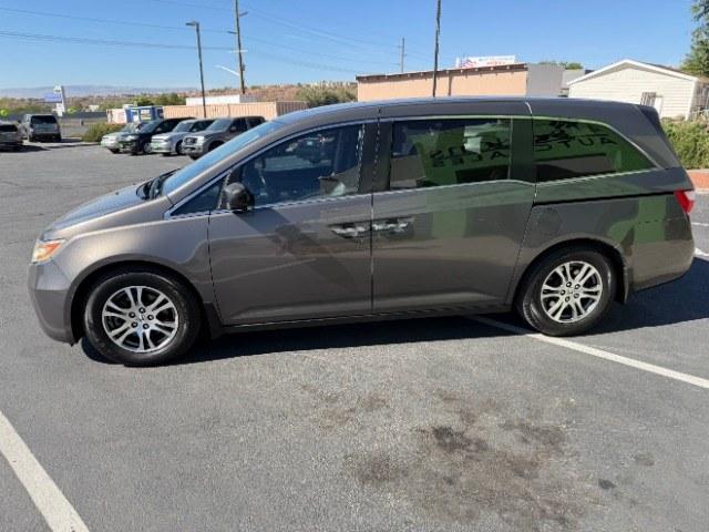 2013 Smoky Topaz Metallic /Truffle Honda Odyssey EX-L (5FNRL5H65DB) with an 3.5L V-6 i-VTEC variable valve control engine, Automatic transmission, located at 1865 East Red Hills Pkwy, St. George, 84770, (435) 628-0023, 37.120850, -113.543640 - This 2013 Honda Odyssey EX-L sits in St. George at $12,000. The odometer reads 152,993. Listed sales price includes $300 doc fee. 4 REASONS TO BUY FROM 4 SEASONS ~~CERTIFIED PREOWNED - This vehicle has gone through a 50 point inspection and road test. We fixed everything that was broken or worn o- Photo#3