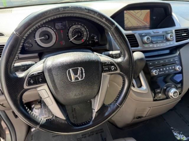 2013 Smoky Topaz Metallic /Truffle Honda Odyssey EX-L (5FNRL5H65DB) with an 3.5L V-6 i-VTEC variable valve control engine, Automatic transmission, located at 1865 East Red Hills Pkwy, St. George, 84770, (435) 628-0023, 37.120850, -113.543640 - This 2013 Honda Odyssey EX-L sits in St. George at $12,000. The odometer reads 152,993. Listed sales price includes $300 doc fee. 4 REASONS TO BUY FROM 4 SEASONS ~~CERTIFIED PREOWNED - This vehicle has gone through a 50 point inspection and road test. We fixed everything that was broken or worn o- Photo#13