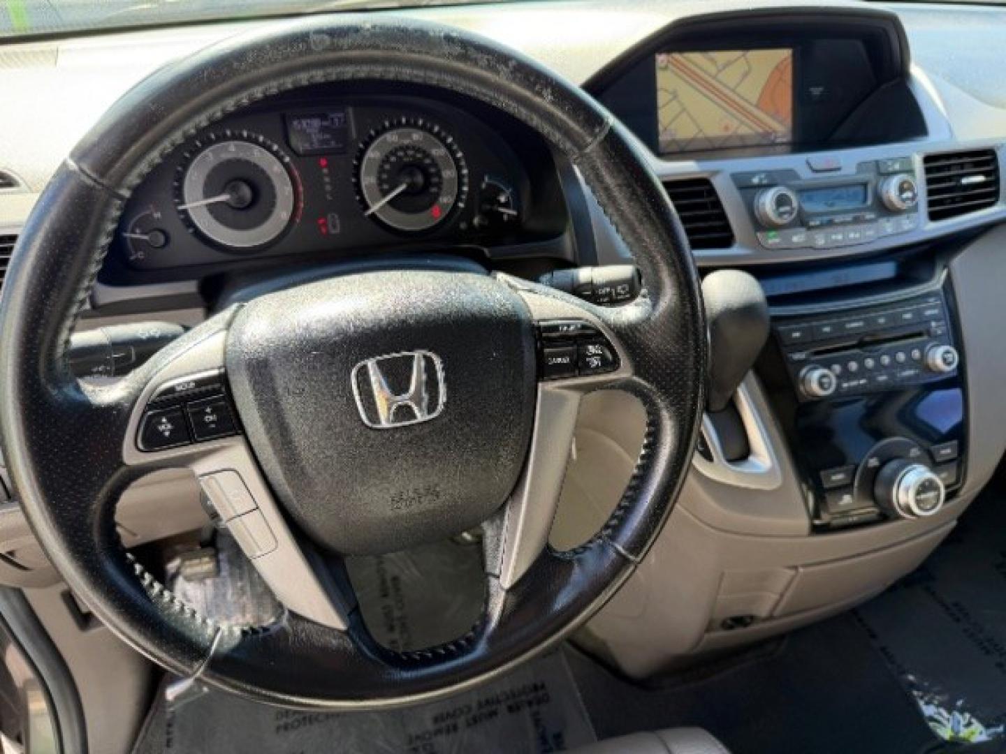 2013 Smoky Topaz Metallic /Truffle Honda Odyssey EX-L (5FNRL5H65DB) with an 3.5L V-6 i-VTEC variable valve control engine, Automatic transmission, located at 1865 East Red Hills Pkwy, St. George, 84770, (435) 628-0023, 37.120850, -113.543640 - Versatile Southern Utah travel starts with this 2013 Honda Odyssey EX-L. Its 3.5L V6 engine, automatic transmission, and front-wheel drive make it a smart fit for school runs, road trips, and family errands. With 152993 miles, this Odyssey is ready for its next adventure. The EX-L adds leather seat- Photo#18