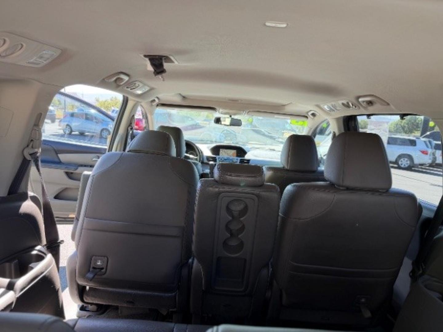 2013 Smoky Topaz Metallic /Truffle Honda Odyssey EX-L (5FNRL5H65DB) with an 3.5L V-6 i-VTEC variable valve control engine, Automatic transmission, located at 1865 East Red Hills Pkwy, St. George, 84770, (435) 628-0023, 37.120850, -113.543640 - Versatile Southern Utah travel starts with this 2013 Honda Odyssey EX-L. Its 3.5L V6 engine, automatic transmission, and front-wheel drive make it a smart fit for school runs, road trips, and family errands. With 152993 miles, this Odyssey is ready for its next adventure. The EX-L adds leather seat- Photo#26