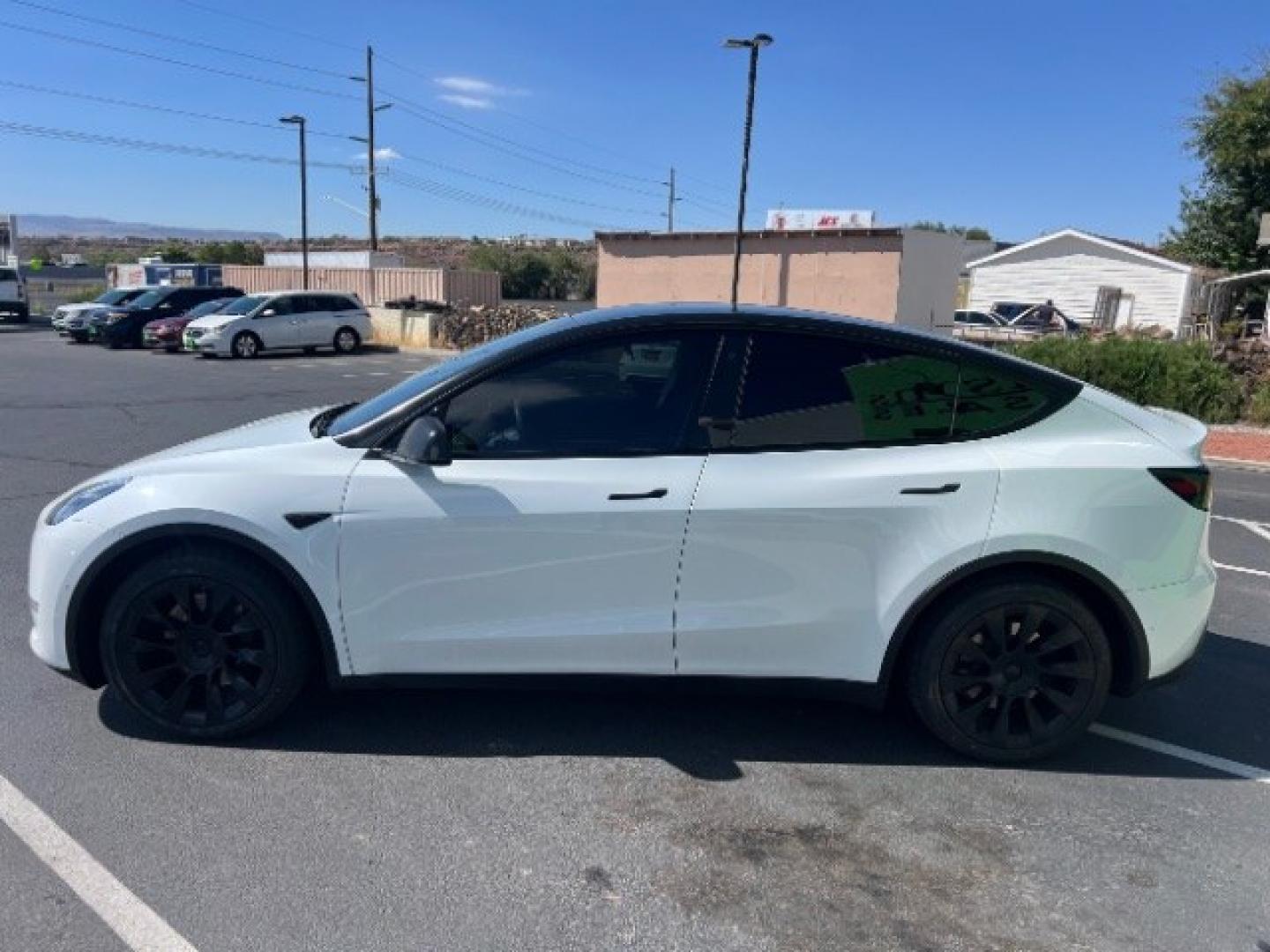 2021 Pearl White Multi-Coat /Black Tesla Model Y Long Range Dual Motor All-Wheel Drive (5YJYGDEE6MF) with an ELECTRIC engine, Electric transmission, located at 1865 East Red Hills Pkwy, St. George, 84770, (435) 628-0023, 37.120850, -113.543640 - Full Self Driving paid for! ($10k add on) Tesla Model Y All Wheel Drive HW3 and 5 Seats, Great tires, Power frunk, small scratch on rear bumper Interior is in great condition. Dont let the miles scare you this Tesla has been thoroughly inspected and has plenty of life. Every Tesla we sell has had- Photo#5