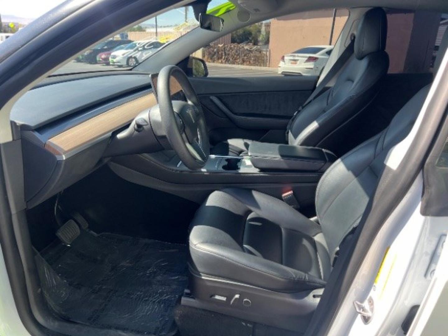 2021 Pearl White Multi-Coat /Black Tesla Model Y Long Range Dual Motor All-Wheel Drive (5YJYGDEE6MF) with an ELECTRIC engine, Electric transmission, located at 1865 East Red Hills Pkwy, St. George, 84770, (435) 628-0023, 37.120850, -113.543640 - Full Self Driving paid for! ($10k add on) Tesla Model Y All Wheel Drive HW3 and 5 Seats, Great tires, Power frunk, small scratch on rear bumper Interior is in great condition. Dont let the miles scare you this Tesla has been thoroughly inspected and has plenty of life. Every Tesla we sell has had- Photo#16