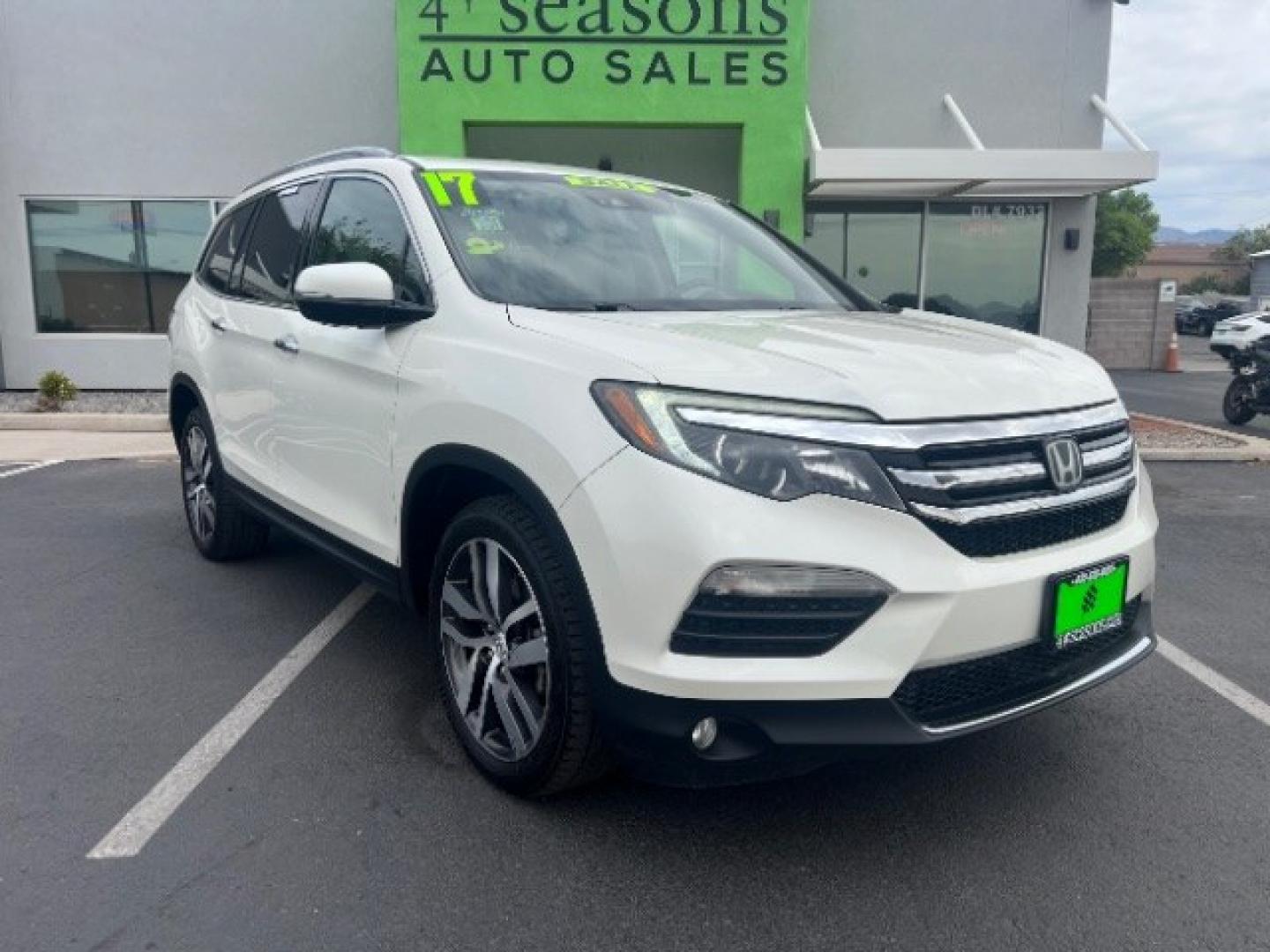 2017 White Diamond Pearl /Beige Honda Pilot Elite (5FNYF6H08HB) with an 3.5L V-6 gasoline direct injection engine, Automatic transmission, located at 1865 East Red Hills Pkwy, St. George, 84770, (435) 628-0023, 37.120850, -113.543640 - We specialize in helping ALL people get the best financing available. No matter your credit score, good, bad or none we can get you an amazing rate. Had a bankruptcy, divorce, or repossessions? We give you the green light to get your credit back on the road. Low down and affordable payments that fit- Photo#0