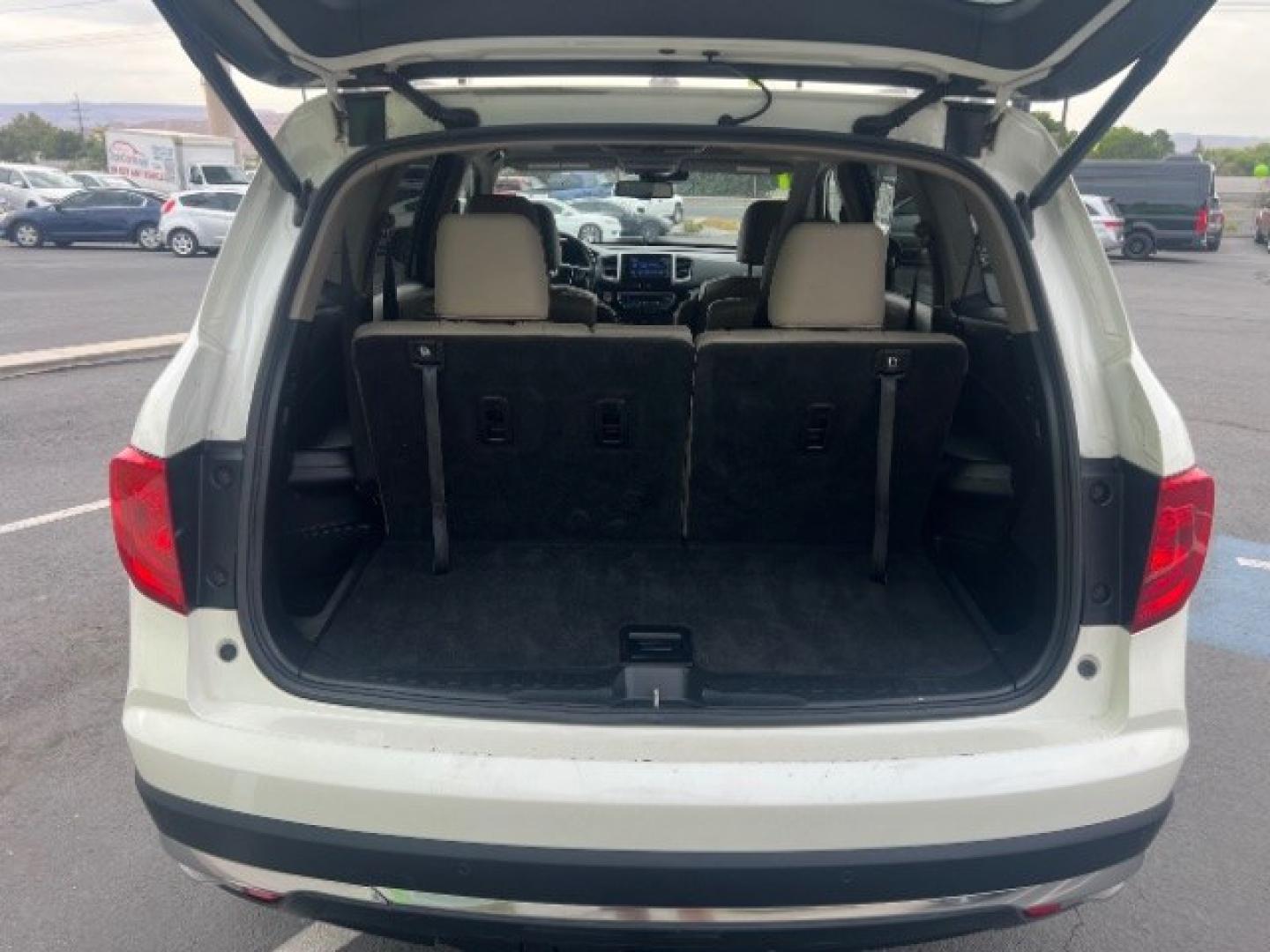 2017 White Diamond Pearl /Beige Honda Pilot Elite (5FNYF6H08HB) with an 3.5L V-6 gasoline direct injection engine, Automatic transmission, located at 1865 East Red Hills Pkwy, St. George, 84770, (435) 628-0023, 37.120850, -113.543640 - We specialize in helping ALL people get the best financing available. No matter your credit score, good, bad or none we can get you an amazing rate. Had a bankruptcy, divorce, or repossessions? We give you the green light to get your credit back on the road. Low down and affordable payments that fit- Photo#27
