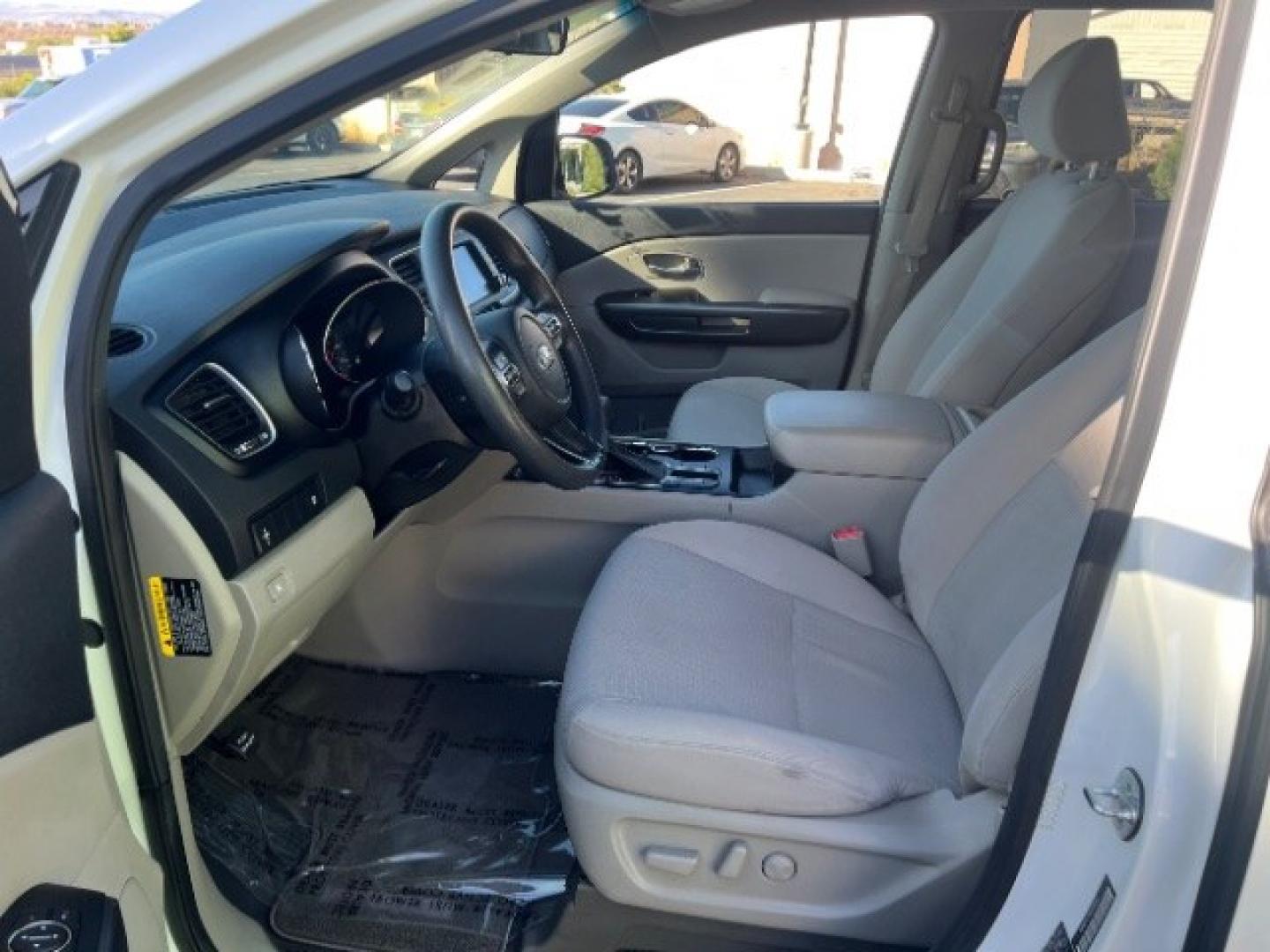 2019 Snow White Pearl /Gray Kia Sedona LX (KNDMB5C17K6) with an Lambda 3.3L V-6 gasoline direct injection engine, Automatic transmission, located at 940 North Main Street, Cedar City, UT, 84720, (435) 628-0023, 37.692936, -113.061897 - Versatile Southern Utah travel starts with this 2019 Kia Sedona LX. Its 3.3L V6 engine, automatic transmission, and front-wheel drive make it a smart fit for family trips, school runs, commuting, and road trips. With 88667 miles, this Sedona is ready for its next adventure. The LX adds three-row se- Photo#14