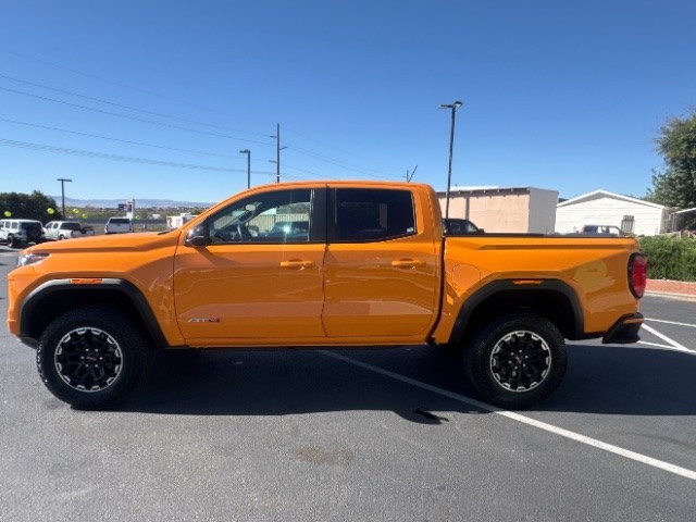 2026 Desert Sun /Jet Black/Timber GMC Canyon AT4, 4WD (1GTP2DEK0T1) with an TurboMax 2.7L I-4 direct injection engine, Automatic transmission, located at 1865 East Red Hills Pkwy, St. George, 84770, (435) 628-0023, 37.120850, -113.543640 - Versatile Southern Utah travel starts with this 2026 GMC Canyon AT4. Its 2.7L turbo 4-cylinder, 8-speed automatic, and four-wheel drive make it a smart fit for job sites, trailheads, towing weekends, and everyday driving. With 17,954 miles, this Canyon is ready for its next adventure. The AT4 adds- Photo#3