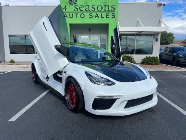 2020 Pearl White Multi-Coat /White/Black Tesla Model 3 Long Range Dual Motor All-Wheel Drive (5YJ3E1EB7LF) with an Electric engine, Electric transmission, located at 1865 East Red Hills Pkwy, St. George, 84770, (435) 628-0023, 37.120850, -113.543640 - Insanely customized Tesla Model 3. One of a kind that is sure to make people notice you! Despite all these custom parts this tesla still operates perfectly. Rides smooth and all Tesla technology works like it should. What makes this M3 so special: Lambo doors, custom hood, rear spoiler, wheels and- Photo#3