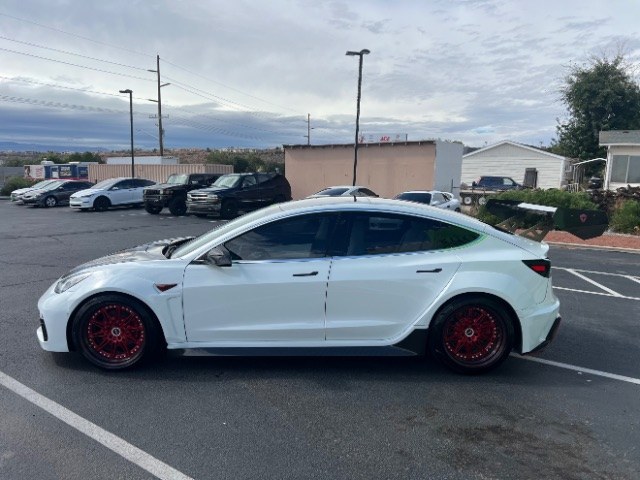 2020 Pearl White Multi-Coat /White/Black Tesla Model 3 Long Range Dual Motor All-Wheel Drive (5YJ3E1EB7LF) with an Electric engine, Electric transmission, located at 1865 East Red Hills Pkwy, St. George, 84770, (435) 628-0023, 37.120850, -113.543640 - Insanely customized Tesla Model 3. One of a kind that is sure to make people notice you! Despite all these custom parts this tesla still operates perfectly. Rides smooth and all Tesla technology works like it should. What makes this M3 so special: Lambo doors, custom hood, rear spoiler, wheels and- Photo#6