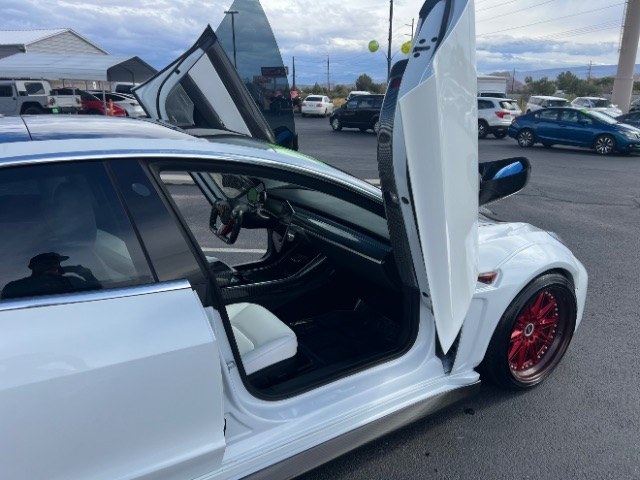 2020 Pearl White Multi-Coat /White/Black Tesla Model 3 Long Range Dual Motor All-Wheel Drive (5YJ3E1EB7LF) with an Electric engine, Electric transmission, located at 1865 East Red Hills Pkwy, St. George, 84770, (435) 628-0023, 37.120850, -113.543640 - Insanely customized Tesla Model 3. One of a kind that is sure to make people notice you! Despite all these custom parts this tesla still operates perfectly. Rides smooth and all Tesla technology works like it should. What makes this M3 so special: Lambo doors, custom hood, rear spoiler, wheels and- Photo#12