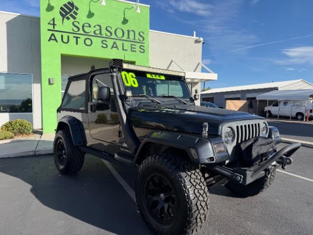 2006 Black Clearcoat/Dark Khaki Soft Top /Dark Slate Gray Jeep Wrangler Unlimited LJ (1J4FA44SX6P) with an Power Tech 4L I-6 regular gasoline engine, Automatic transmission, located at 1865 East Red Hills Pkwy, St. George, 84770, (435) 628-0023, 37.120850, -113.543640 - Versatile Southern Utah travel starts with this 2006 Jeep Wrangler Unlimited LJ LONG WHEEL BASE. Its 4.0L inline 6-cylinder, 4-speed automatic, and 4x4 make it a smart fit for trail exploring, camping trips, and outdoor weekends. With 117,500 miles, this Wrangler is ready for its next adventure. Th- Photo#0