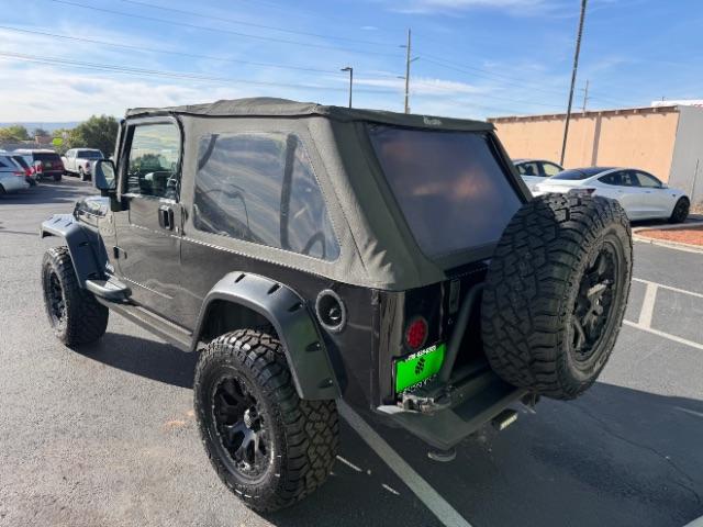 2006 Black Clearcoat/Dark Khaki Soft Top /Dark Slate Gray Jeep Wrangler Unlimited LJ (1J4FA44SX6P) with an Power Tech 4L I-6 regular gasoline engine, Automatic transmission, located at 1865 East Red Hills Pkwy, St. George, 84770, (435) 628-0023, 37.120850, -113.543640 - Versatile Southern Utah travel starts with this 2006 Jeep Wrangler Unlimited LJ LONG WHEEL BASE. Its 4.0L inline 6-cylinder, 4-speed automatic, and 4x4 make it a smart fit for trail exploring, camping trips, and outdoor weekends. With 117,500 miles, this Wrangler is ready for its next adventure. Th- Photo#4