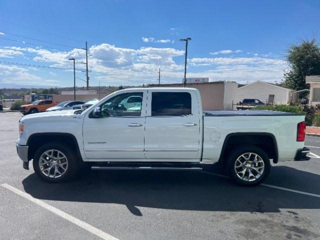2015 Summit White /Cocoa/Dune GMC Sierra 1500 SLT (3GTU2VEC6FG) , Automatic transmission, located at 1865 East Red Hills Pkwy, St. George, 84770, (435) 628-0023, 37.120850, -113.543640 - Versatile Southern Utah travel starts with this 2015 GMC Sierra 1500 SLT Crew Cab. Its 5.3L V8, 6-speed automatic, and 4WD make it a smart fit for work days, weekend projects, and outdoor trips. With 112,695 miles, this Sierra is ready for its next adventure. The SLT adds air conditioning, alloy wh- Photo#3
